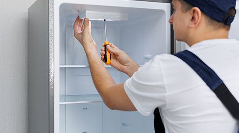 Certified Techman technician performing same-day refrigerator repair in Ottawa for major brands like Samsung, LG, and Whirlpool in Kanata, Nepean, and Barrhaven.